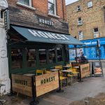 Wooden Framed Cafe Panels outside Honest Burger, Wooden Restaurant Panels, Cafe Screens, Powder Coated Cafe Barrier Posts, Bespoke Cafe Panels, Custom-Made Cafe Panels, Commercial Cafe Panels, Hospitality Cafe Panels, printed cafe barriers