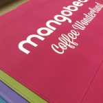 Mangobean - Multiple Canvas Colours with a White Heat Pressed Vinyl Logo