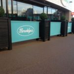 Valant Wooden Café Planter, Wooden Valant Planters painted Black with Turquoise Canvas Banners for Brooklyn's, printed café banners, bespoke café banners, handmade café banners, custom café banners, café screens, fabric café banners, custom made cafe planters, wooden tall cafe planters, bespoke cafe planters, Restaurant planters, commercial planters, outdoor planters, wood planters