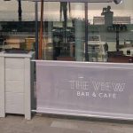Valant Wooden Café Planter, Wooden Valant Planters painted Grey with Mesh Banners for The View, Restaurant planters, commercial planters, outdoor planters, wood planters, pvc mesh cafe banners, bespoke planters, custom made planters