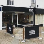 Natural Café Barrier Posts with Black Canvas Banners