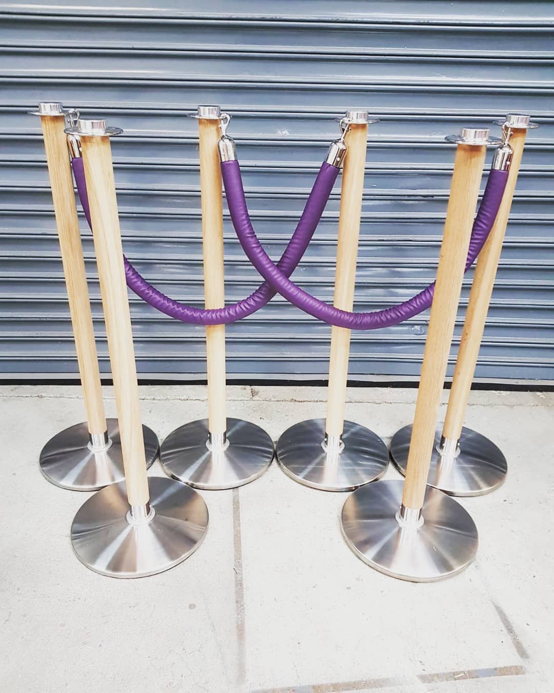 Natural Wooden Cafe Barrier Posts with Round Base & Naugahyde Leather Rope in Purple