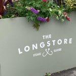 Longshore Restaurant in Cornwall Forjado Metal Planters Powder Coated in Green with their logos to all Close Up