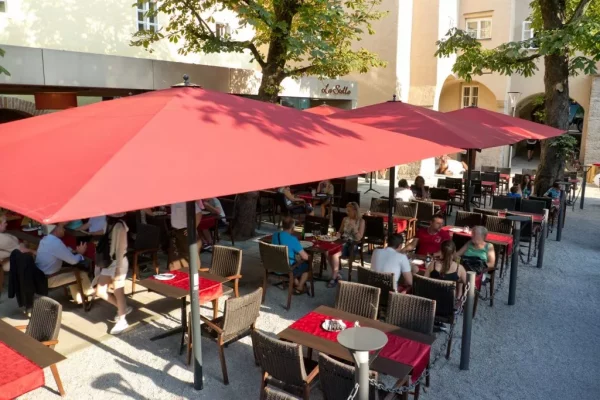 Big Ben Caravita Commercial Giant Umbrella in Red outside Restaurant