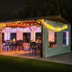 Commercial Wooden Gazebo - Side View with Lights & Black Furniture, Wooden Cafe Pergola, Restaurant Pergola, Outdoor Pergola, Pub Pergola