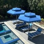 Double Decker Giant Umbrella in Blue with a White Fringe Valance in Pool Setting - Santa Barbara, Commercial Umbrellas, Commercial Giant Umbrellas, Restaurant Parasols, Hospitality Giant Umbrella, Pub Parasol